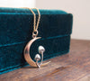 Crescent moon and mushroom necklace