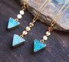 Angled picture of 3 gold edged, triangle gemstone necklaces with coin detail