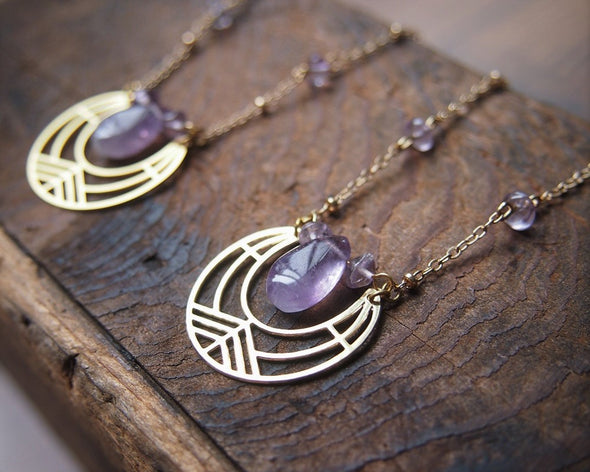 Gold geometric necklace with raw amethyst