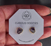 Raw amethyst chip earrings on Curious Oddities backing card