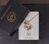 Gold photo locket necklace in a gift box