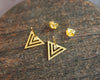Back view of shiny gold geometric triangle stud earrings with backings